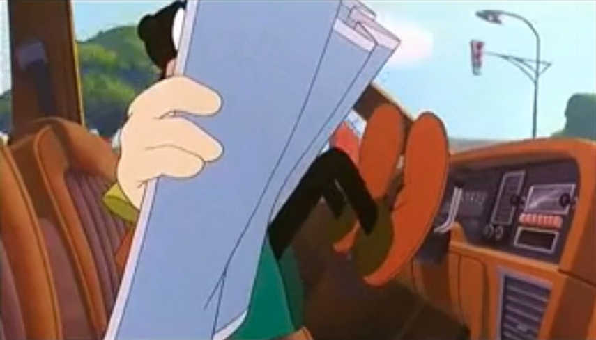 Goofy looks at a paper map while driving.